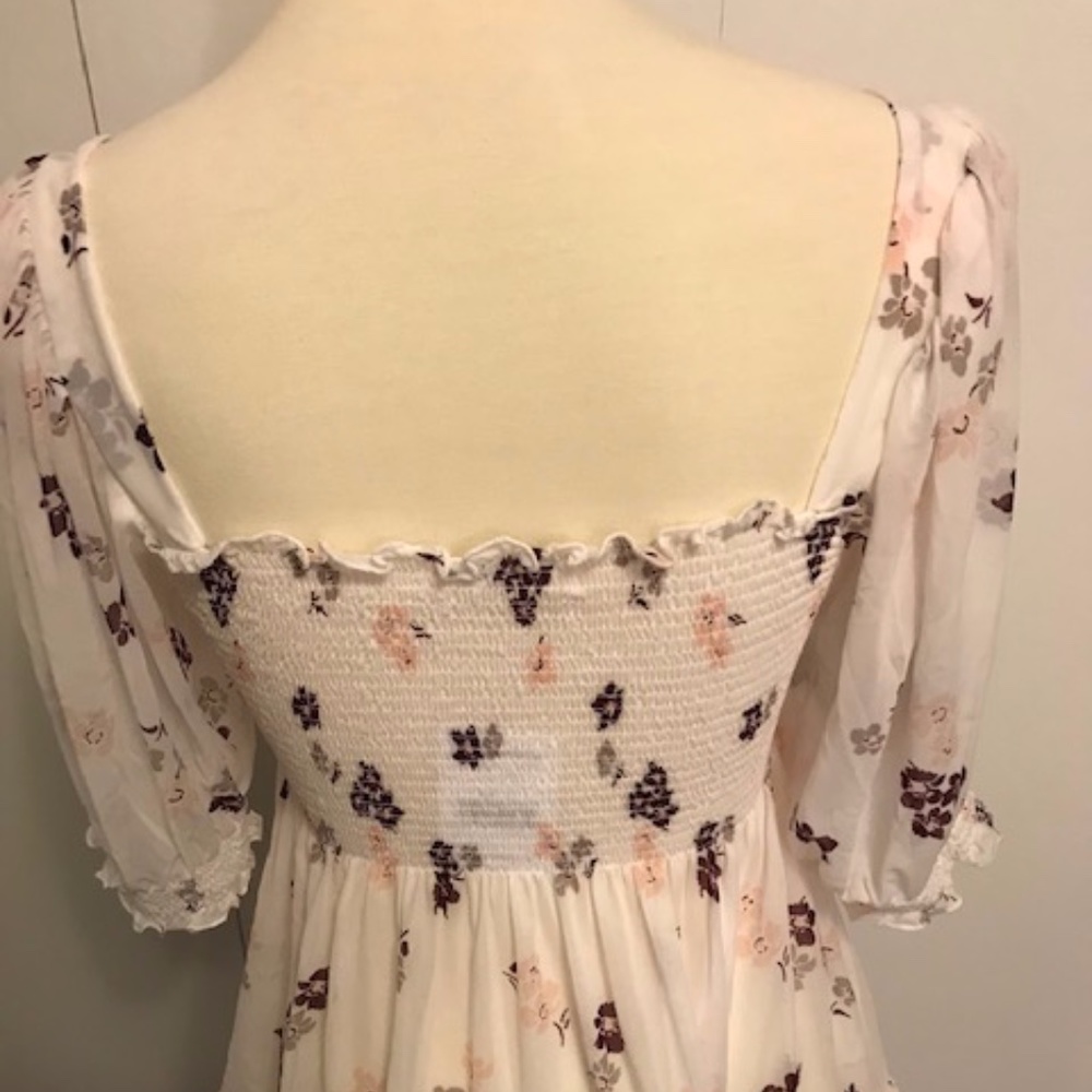 White floral print smocked top with puff sleeves